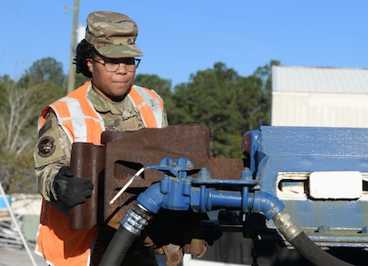 Staff Sgt. Gelisa Inniss, 628th Logistics Readiness Squadron NCO in charge of ground transportation operations center, Naval Weapons Station, inspects a railcar coupling at Joint Base Charleston NWS in Goose Creek, S.C., Jan. 7, 2020. Innis was the first female active duty Airman to complete the Brakeman Switchman Course at Joint Base Langley-Eustis, VA. (U.S. Air Force photo by Senior Airman Joshua R. Maund)