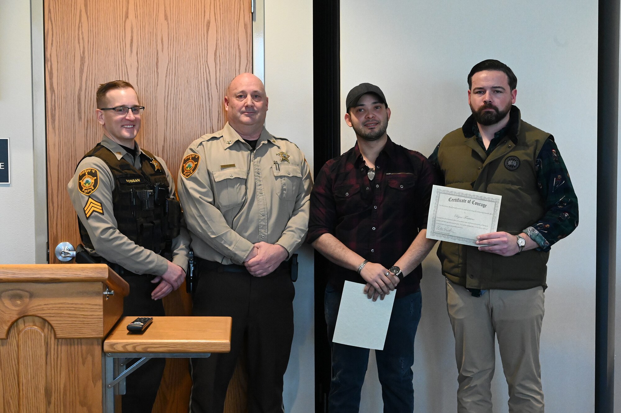 Photo of Tech Sgt. Ryan Fontaine being recognized by Ward County, N.D. Sheriff.