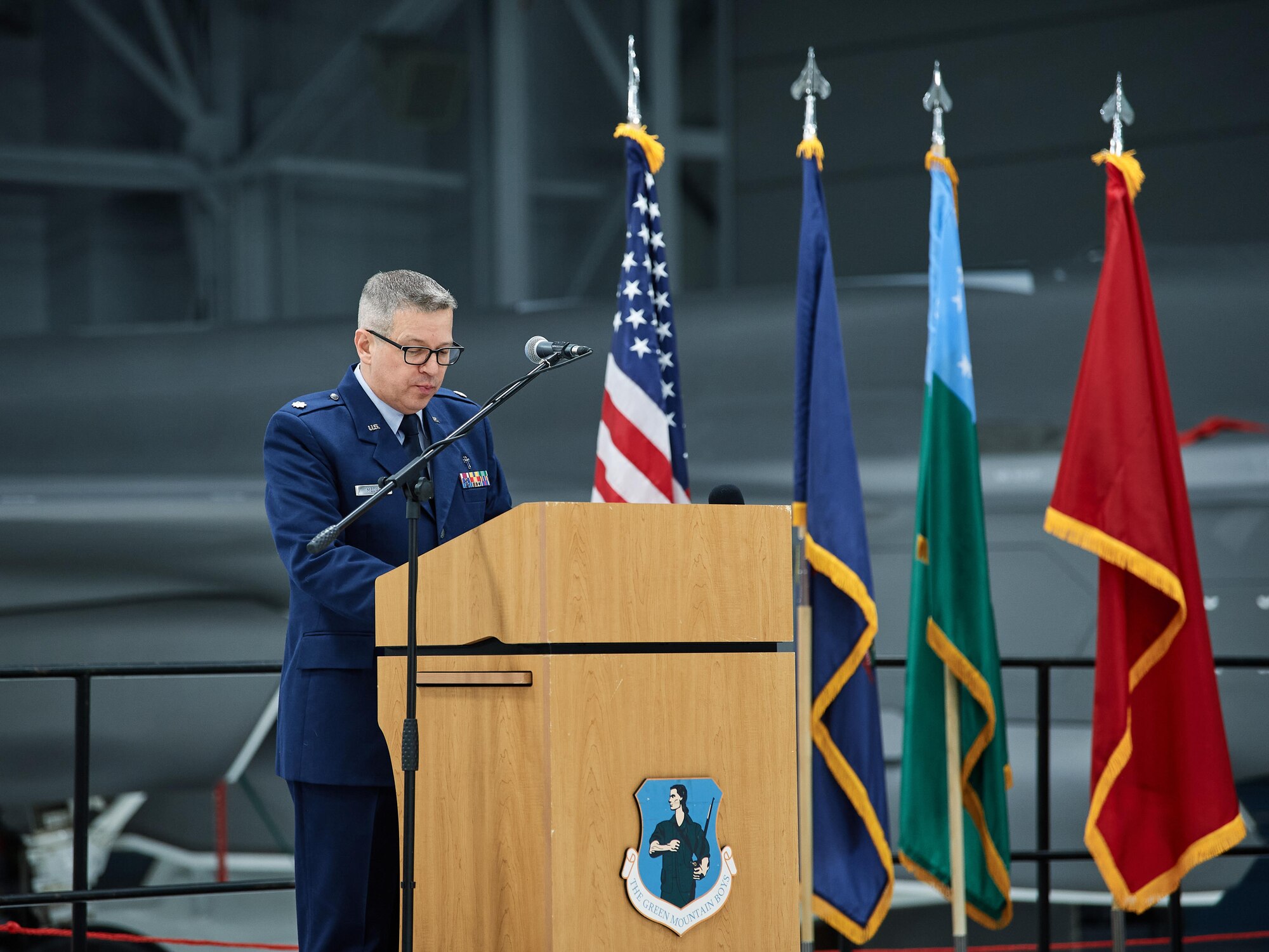 Lt. Col. Michael Medas, a chaplain assigned to the 158th Fighter Wing, Vermont Air National Guard, delivers the benediction at the start of a change of command ceremony