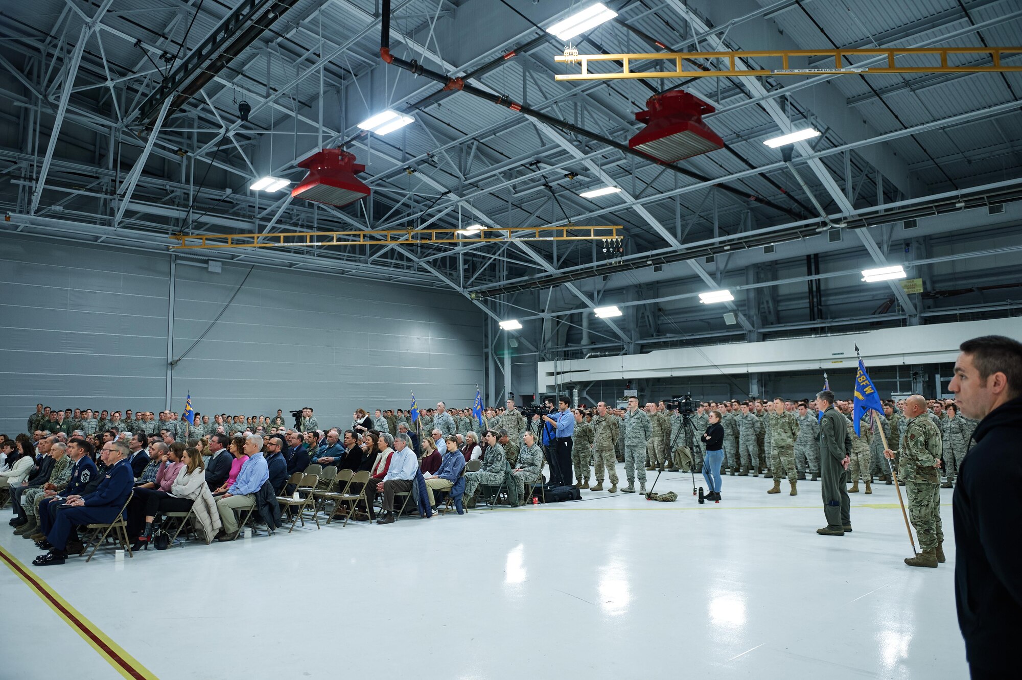 158th Fighter Wing members, friends, family and media gather at a change of command ceremony for the 158th Fighter Wing