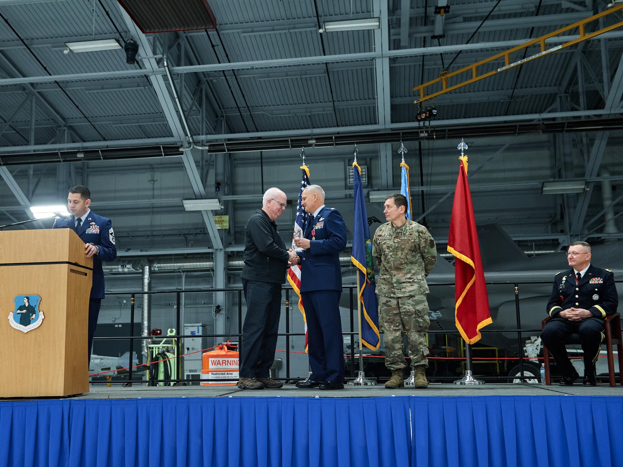 Mr. Jack Russell, an honorary commander of the 158th Fighter Wing, Vermont Air National Guard, is presented with the inaugural "True North" award