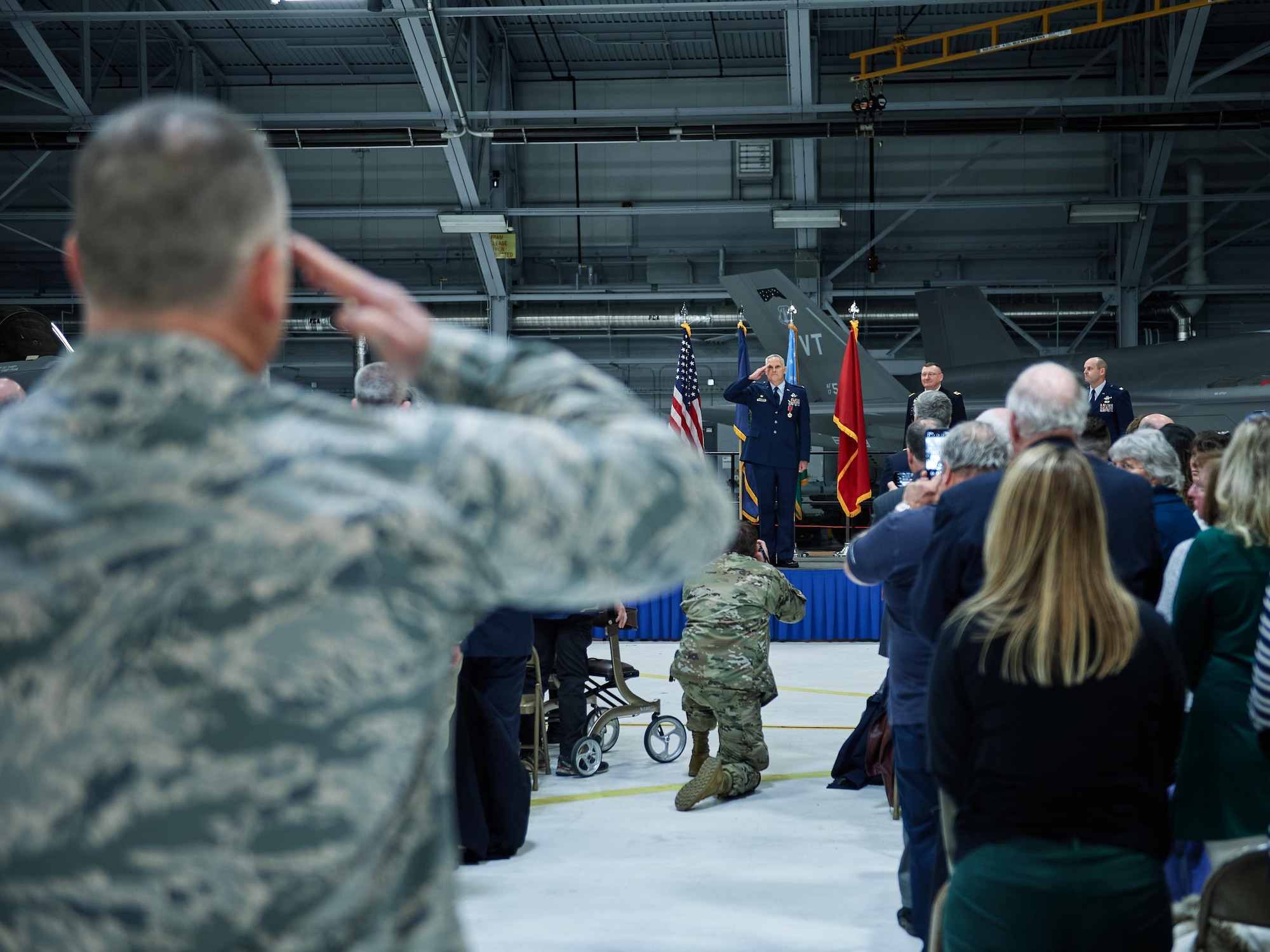 The 158th Fighter Wing, Vermont Air National Guard, renders a final salute to Col. David Smith, outgoing commander of the wing, during a change of command ceremony