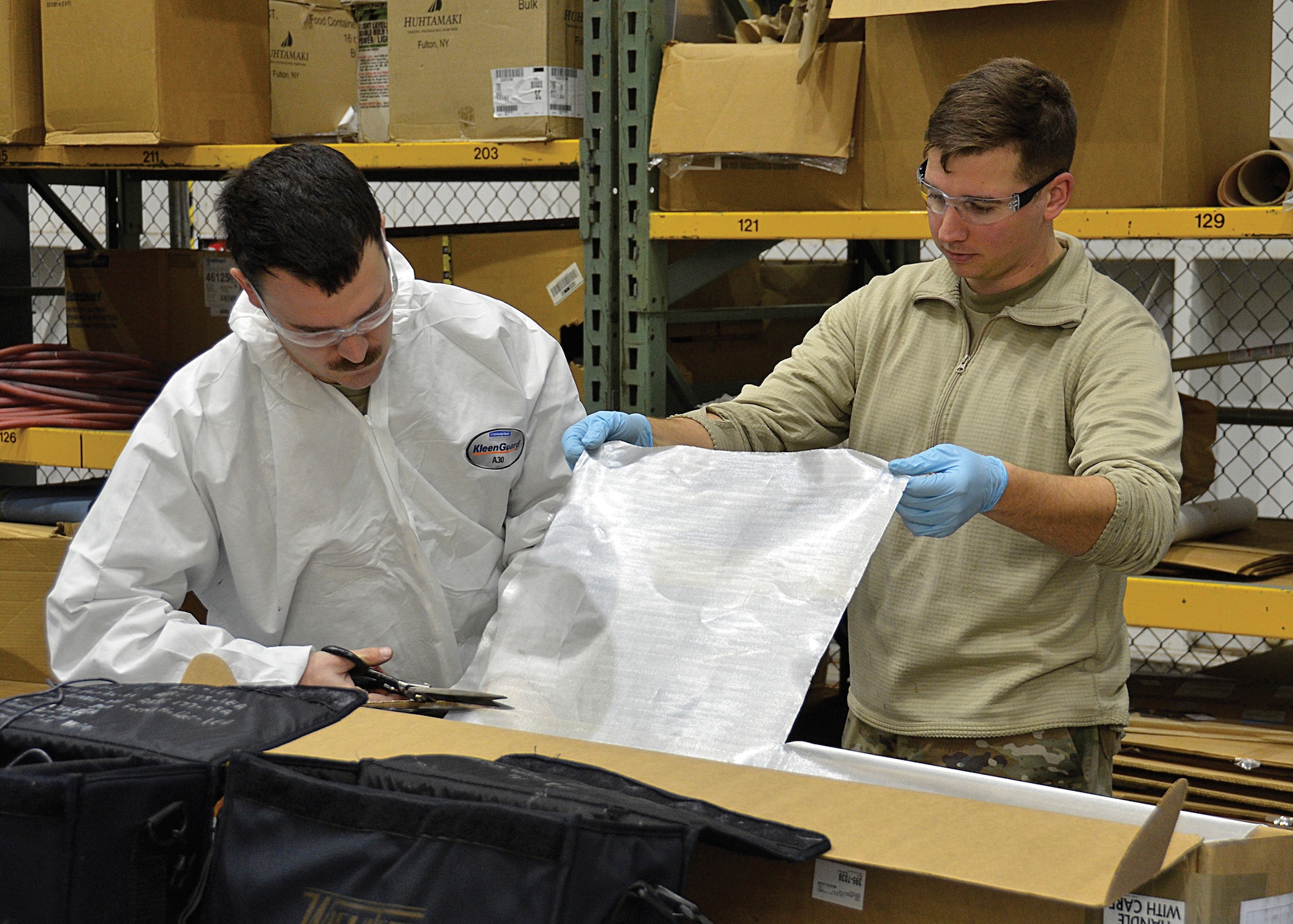 Senior Airman Larry Depasquale and Staff Sgt. Jarred Steel, aircraft structural technicians with the 445th Maintenance Squadron’s fabrication section, prepare to repair the mesh layer of a C-17 Globemaster III tail component. The mesh layer dissipates lightning on flight control surfaces and prevents damage to the body of the aircraft and the internal systems. This repair is integral to the safety of the aircraft and its crew. The 445th MXS is part of the Wright-Patterson Air Force Base’s 445th Airlift Wing, home to nine C-17 Globemaster III aircraft and nearly 2,000 Reserve Citizen Airmen. (U.S. Air Force photo by Staff Sgt. Ethan G. Spickler)