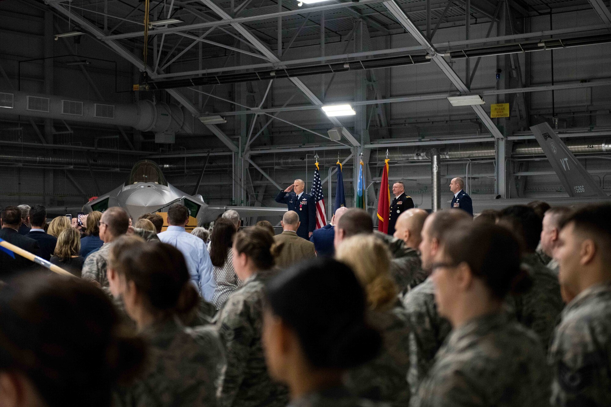 Col. David Smith, outgoing commander of the 158th Fighter Wing, renders a final salute to the Airmen of the Vermont Air National Guard during a change of command ceremony