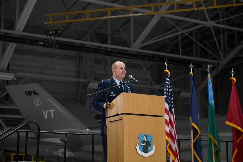 Col. David Shevchik Jr., incoming commander of the 158th Fighter Wing, Vermont Air National Guard, addresses Airmen, family and friends in attendance during a change of command ceremony