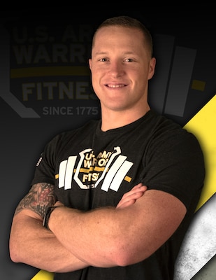 Man with red-blond hair in black t-shirt crossing his arms against a black, yellow and white background.