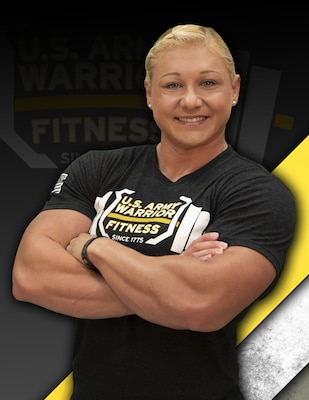 Blond female in black tshirt with arms crossed against a black, yellow and white background.