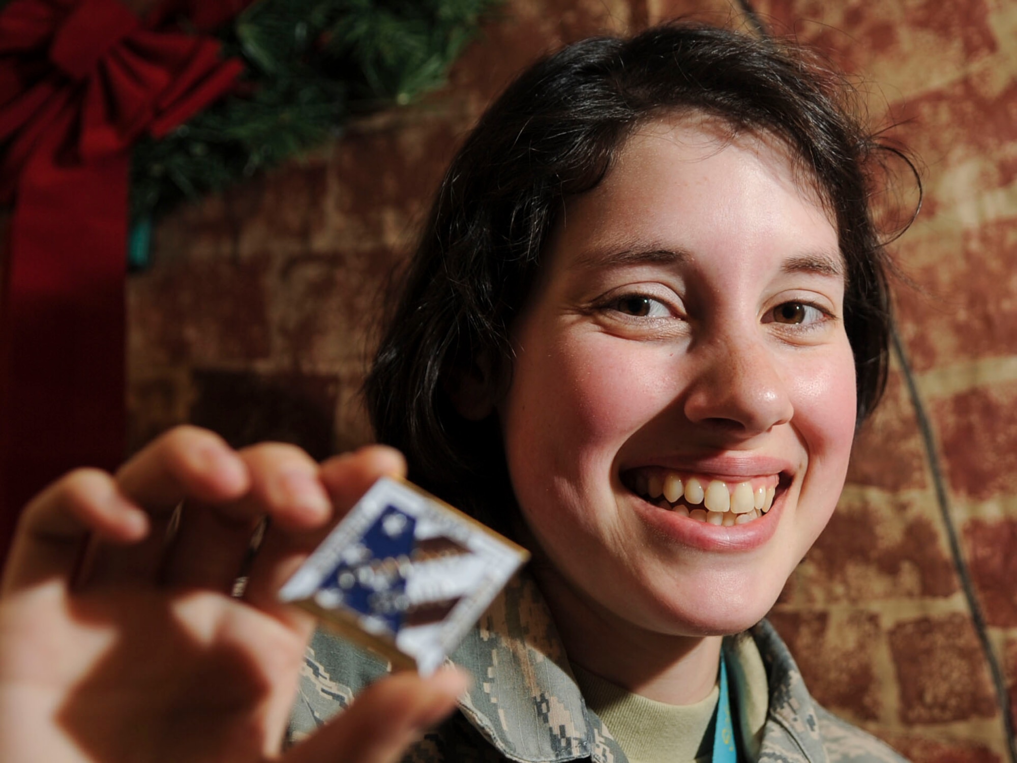 Staff Sgt. Mikayla Dlask, Future Threats Analysis Squadron force modernization analyst, is presented with the Diamond Sharp Award by First Sgts Senior Master Sgt. William Schipper and Juan Villa at the National Air and Space Intelligence Center on Wright-Patterson Air Force Base, Ohio, Dec. 18, 2019. The Diamond Sharp Award recognizes Airmen who have actively demonstrated their commitment to Air Force values or have gone above and beyond in helping others. (U.S. Air Force photos by Staff Sgt. Seth Stang)