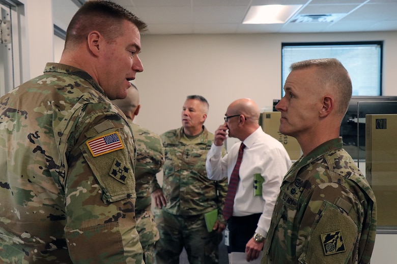 Transatlantic Division Commander Col. Chris Beck (left) discusses the work being done to the TAD headquarters building as part of the TAD "workforce transformation" plan with USACE Command Sergeant Major Bradley Houston.