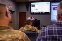 Harold Richardson, Joint Task Force Civil Support (JTF-CS) geographic information system coordinator, briefs JTF-CS and Defense Chemical, Biological, Radiological and Nuclear (CBRN) Response Force (DCRF) personnel during the command’s Exercise Sudden Response 2020 (SR20) staff academics conference, held at the command’s headquarters, Jan. 6-8. During the event, JTF-CS and DCRF personnel focused on major movements and friction points that would be encountered during the deployment and operation phases of SR20. (Official DoD photo by Mass Communication Specialist 3rd Class Michael Redd/RELEASED)