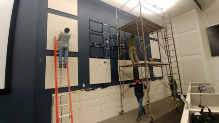 Photo of Depot employees install infrastructure for a Home Station Mission Command Center.