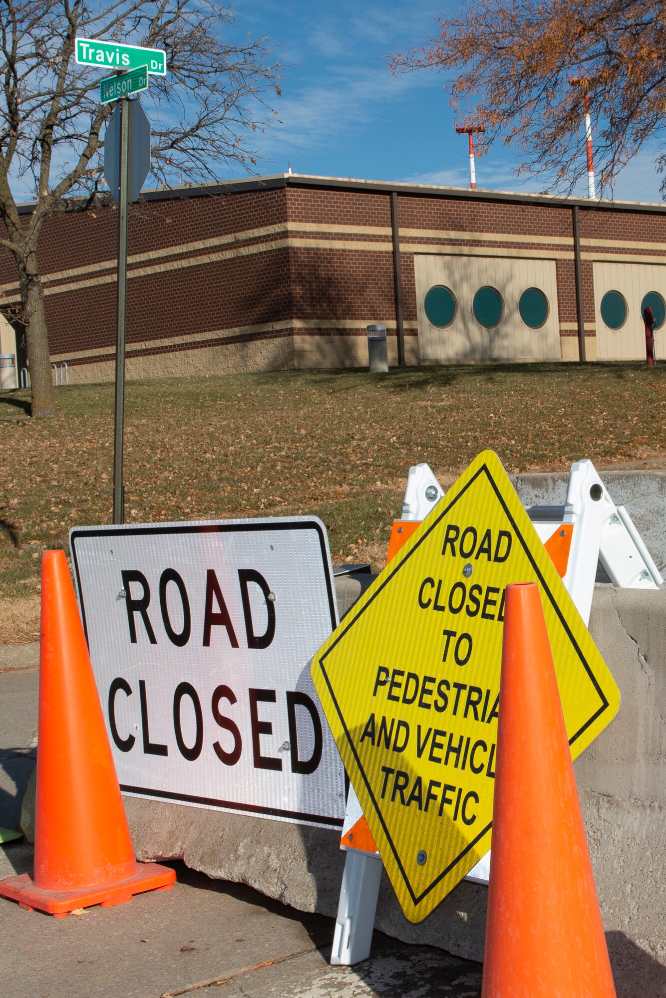 Construction signs sit on a closed road at Offutt Air Force Base, Neb., Nov. 19, 2019.