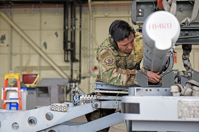 U.S. Air Force Staff Sgt. David Torres, 35th Aircraft Maintenance Unit load crew team chief, loads an F-16 Fighting Falcon aircraft during the 8th Maintenance Group’s fourth quarter Weapons Load Crew Competition at Kunsan Air Base, Republic of Korea, Jan. 3, 2020. The three-person crews were evaluated on safety, reliability, technical proficiency and time. (U.S. Air Force photo by Staff Sgt. Mackenzie Mendez)