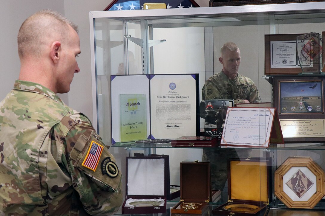 USACE Command Sergeant Major Bradley Houston admires one of the display cases at the Transatlantic Division headquarters in Winchester, Va.