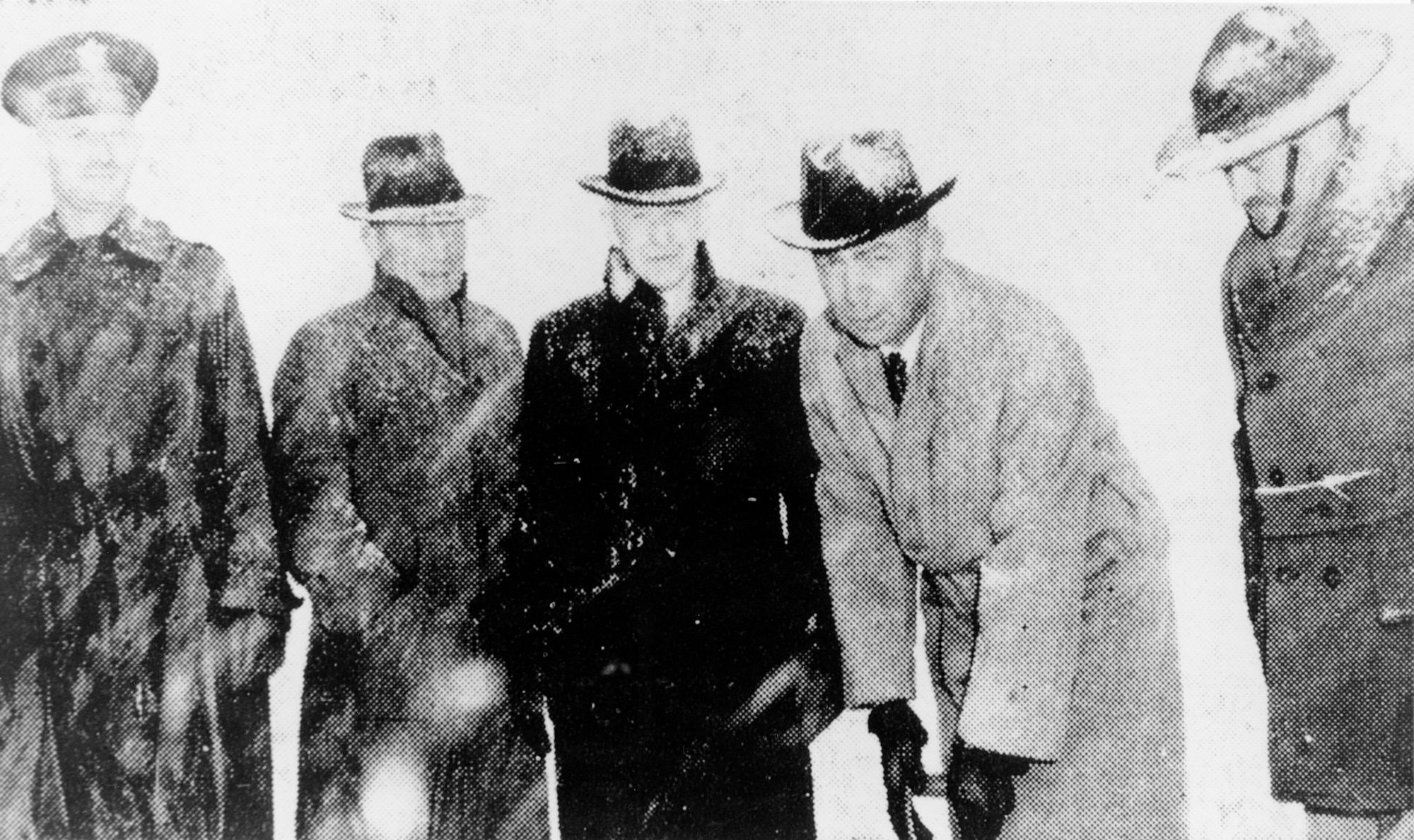 A black and white photo of five men posing for a photo during the ground breaking of Hill Field on Jan. 12, 1940.