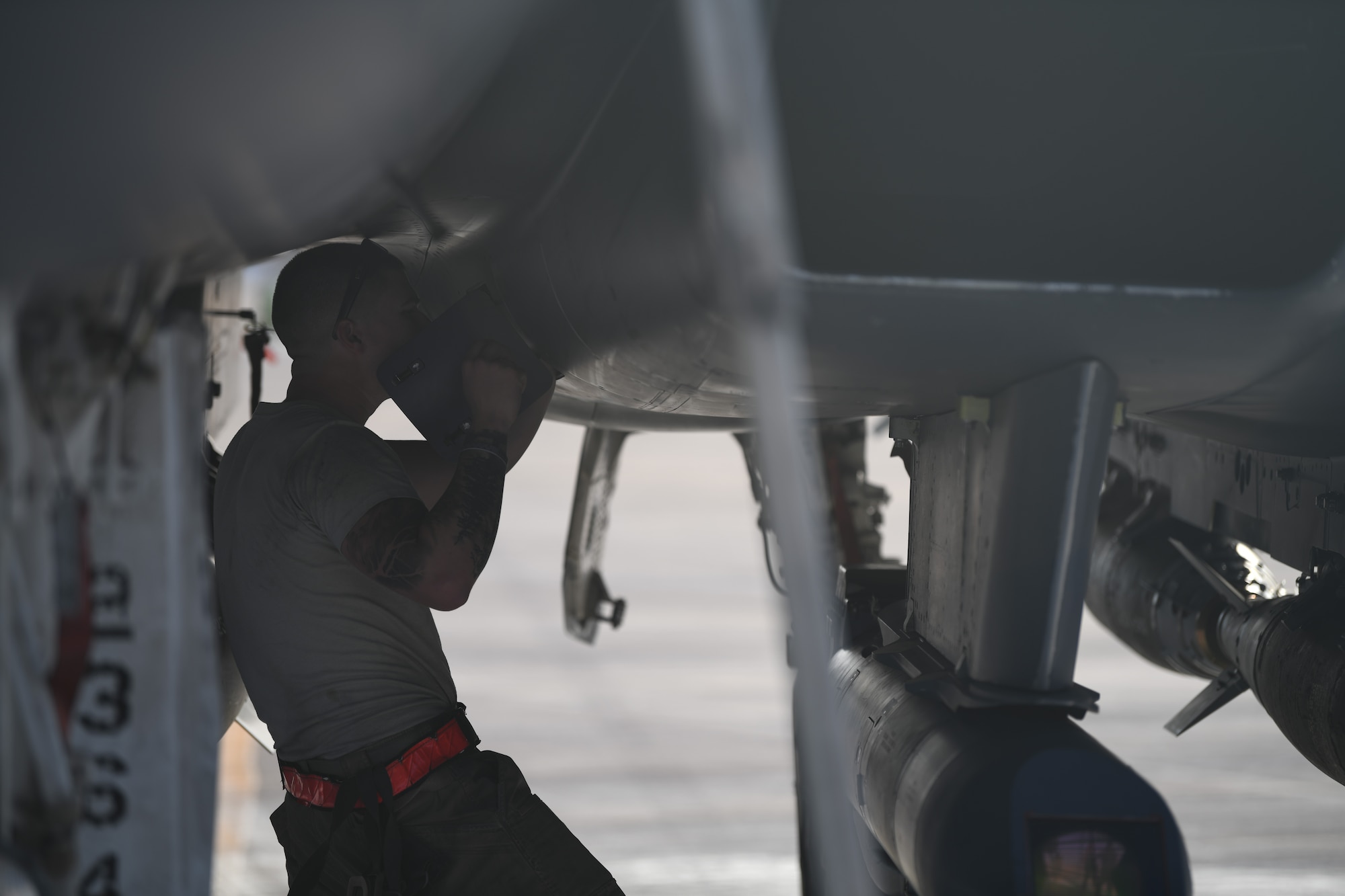 U.S. Air Force Staff Sgt. Zackary Suttles, a crew chief with the 378th Expeditionary Maintenance Squadron, conducts a post landing inspection on an F-15E Strike Eagle at Prince Sultan Air Base, Kingdom of Saudi Arabia, Jan. 4, 2020.