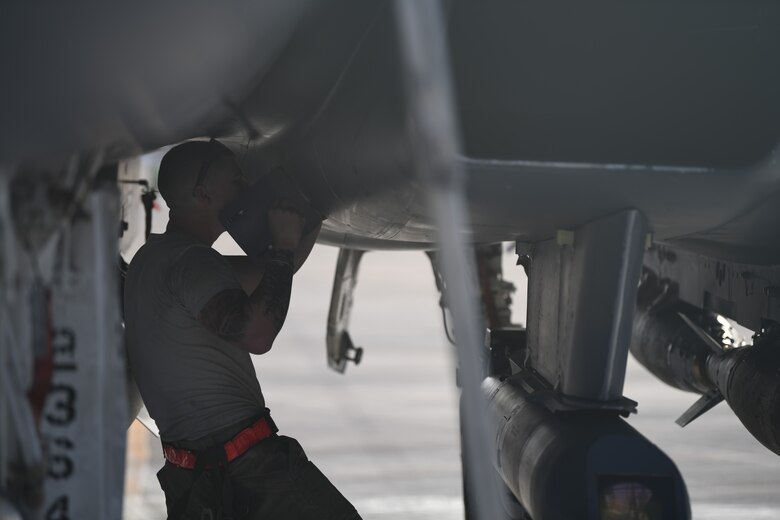 U.S. Air Force Staff Sgt. Zackary Suttles, a crew chief with the 378th Expeditionary Maintenance Squadron, conducts a post landing inspection on an F-15E Strike Eagle at Prince Sultan Air Base, Kingdom of Saudi Arabia, Jan. 4, 2020.