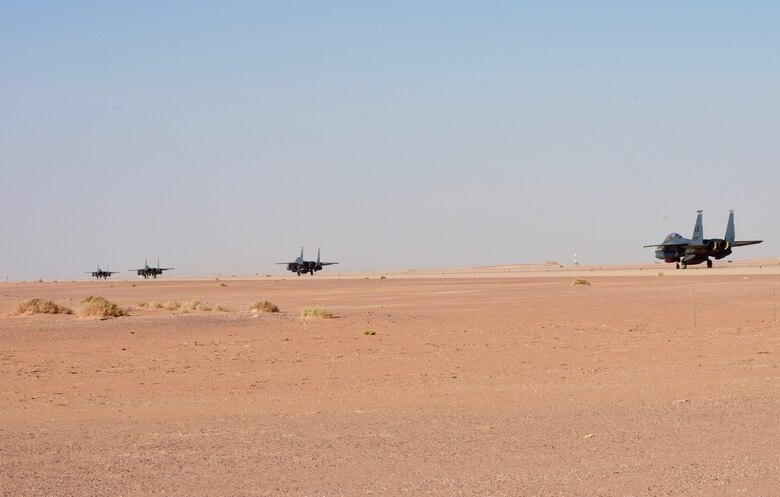 Two U.S. Air Force F-15E Strike Eagle assigned to the 494th Expeditionary Fighter Squadron taxi on the runway at Prince Sultan Air Base, Kingdom of Saudi Arabia, Jan. 4, 2020.