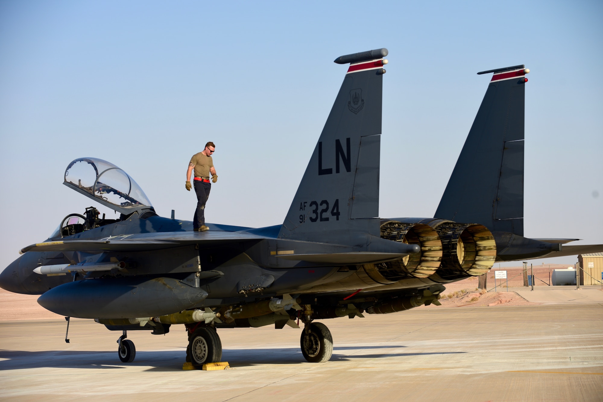 U.S. Air Force Staff Sgt. Zackary Suttles, a crew chief with the 378th Expeditionary Maintenance Squadron, conducts an inspection on an F-15E Strike Eagle at Prince Sultan Air Base, Kingdom of Saudi Arabia, Jan. 4, 2020.