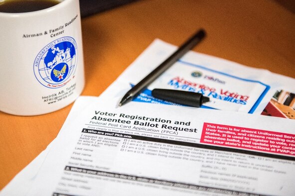 A voter registration and absentee ballot lies on a table in the Airman and Family Readiness Center, Jan. 8, 2020, at Incirlik Air Base, Turkey. Though Incirlik Airmen may be away from their home state, they still have the ability to submit an absentee ballot. (U.S. Air Force photo by Senior Airman Trevor Gordnier)