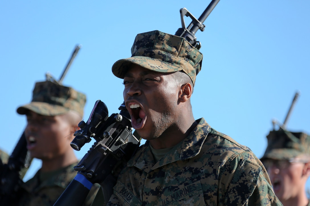 A Marine Corps recruit screams during a drill competition.