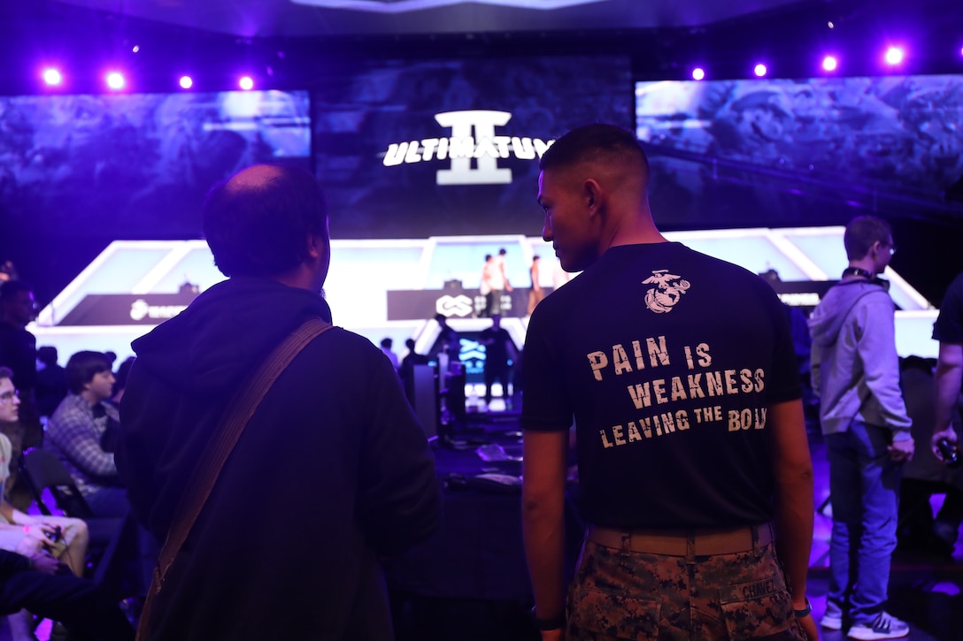 A U.S. Marine recruiter converses with an attendee during Ultimatum II, a Smash Ultimate Tournament hosted by Esports Stadium Arlington, in Arlington, Texas, December 27.