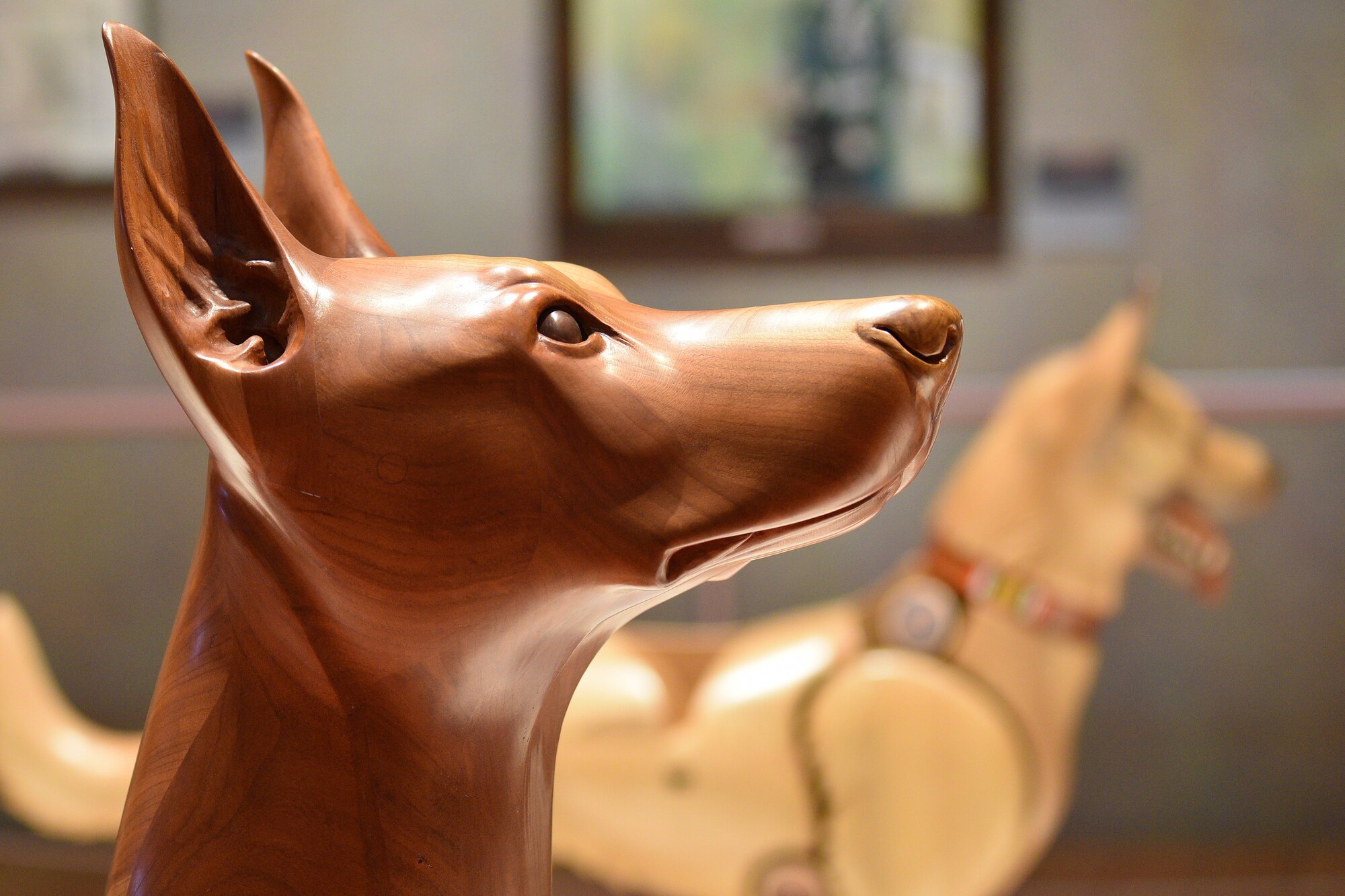 Photo of a wooden dog carving.