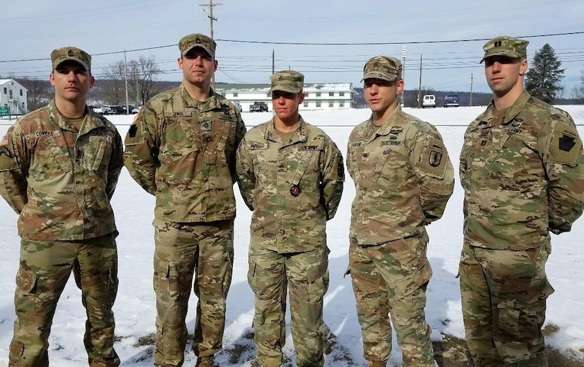 Sgt. Danielle Farber (center), a medical instructor at the 166th Regiment Regional Training Institute at Fort Indiantown Gap, stands with other Ranger School graduates at Fort Indiantown Gap on Thursday, Jan. 9, 2020. In December, Farber became the first female Soldier from the Pennsylvania National Guard to graduate from U.S. Army Ranger School.  (U.S. Army National Guard photo by Brad Rhen)