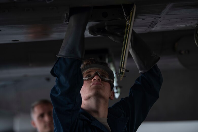 U.S. Air Force Airman 1st Class Bradley Smith, 18th Aircraft Maintenance Squadron crew chief, performs post-flight inspections during Exercise WestPac Rumrunner Jan. 10, 2020 at Kadena Air Base, Japan. Airmen are trained and empowered to make disciplined decisions at subordinate levels, ensuring the air component commander’s intent is met and the initiative is taken in a contested environment. (U.S. Air Force photo by Senior Airman Rhett Isbell)