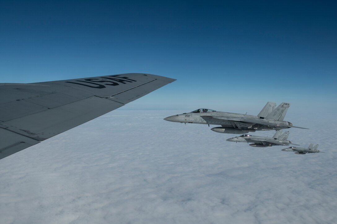 U.S. Navy F/A-18E Super Hornets fly alongside a 909th Air Refueling Squadron KC-135 Stratotanker after aerial refueling during Exercise WestPac Rumrunner at Kadena Air Base, Japan, Jan. 10, 2020. The exercise provides an opportunity for Kadena Airmen to practice a diverse array of capabilities in addition to working alongside joint partners in the Army, Navy and Marine Corps. (U.S. Air Force photo by Tech. Sgt. Matthew B. Fredericks)