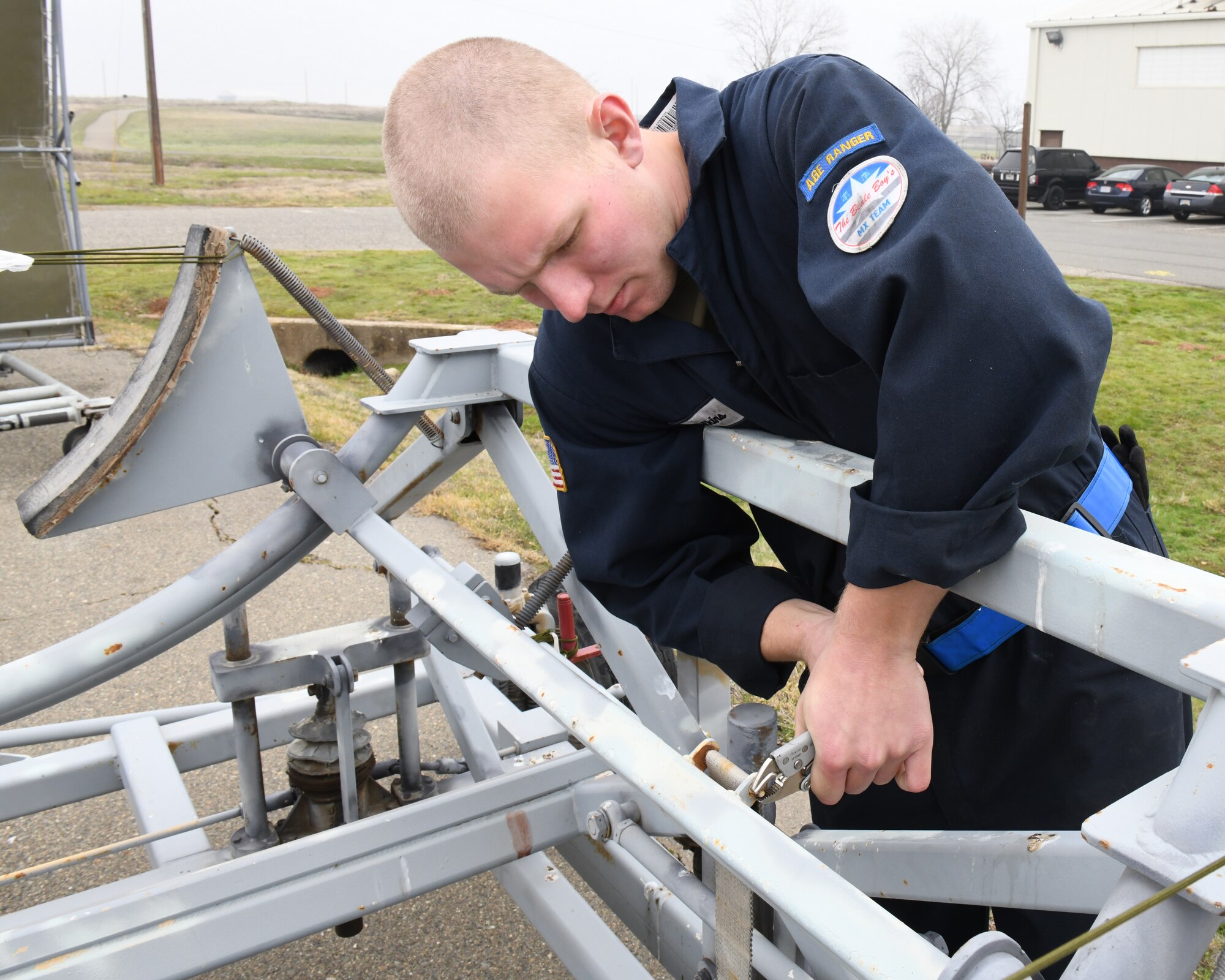 Airman 1st Class Calvin Wilkins, 9th Maintenance Squadron aerospace ground equipment journeyman, loosens a nut on an aircraft dolly to remove a strap, Jan. 7 2020 on Beale Air Force Base, California. AGE is a 24/7 operation that is divided into four sections; maintenance, inspection, service and delivery, and support. (U.S. Air Force photo by Airman 1st Class Luis A. Ruiz-Vazquez)