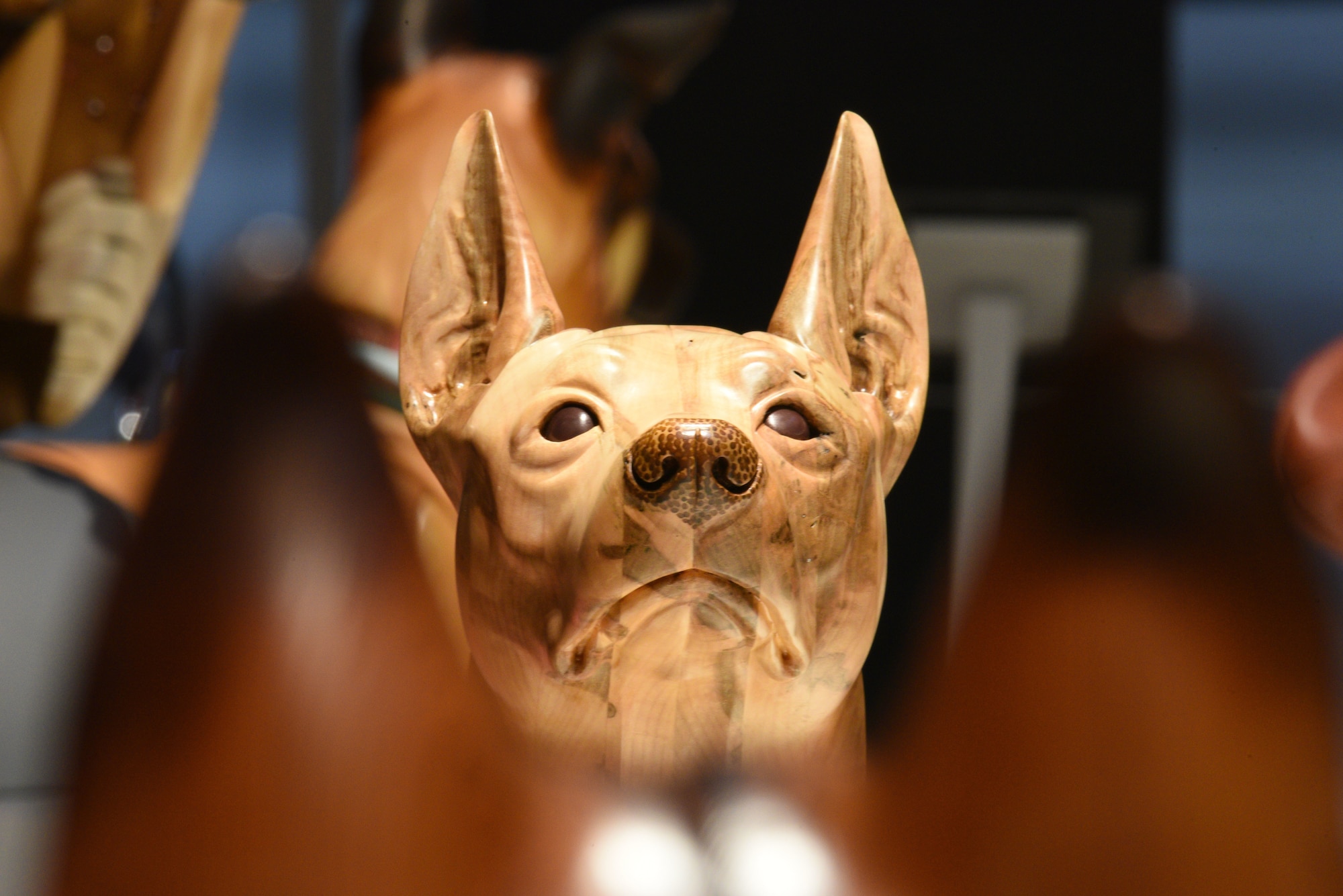 Photo of a wooden dog carving.