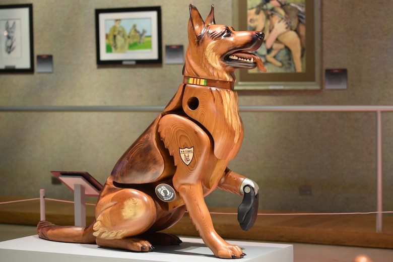 Photo of a wooden dog carving.