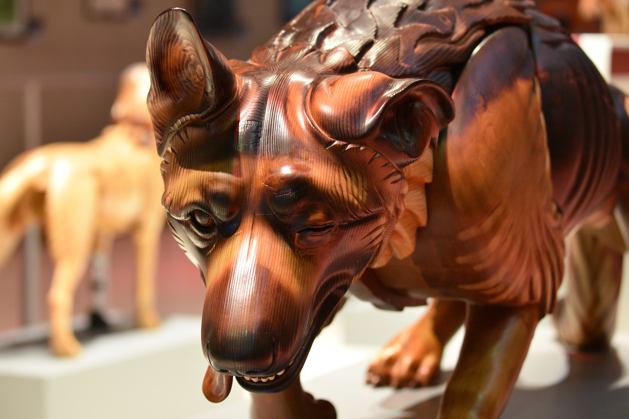 Photo of a wooden dog carving.