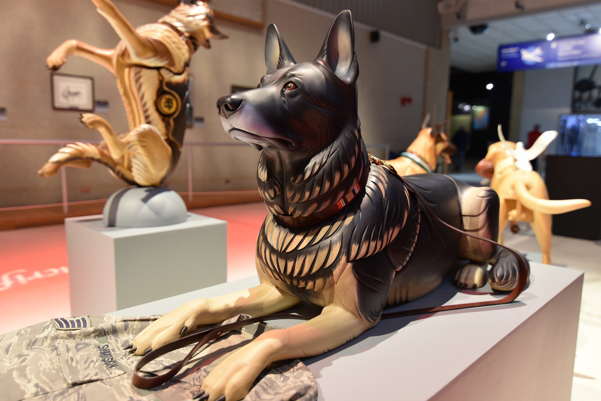 Photo of a wooden dog carving.