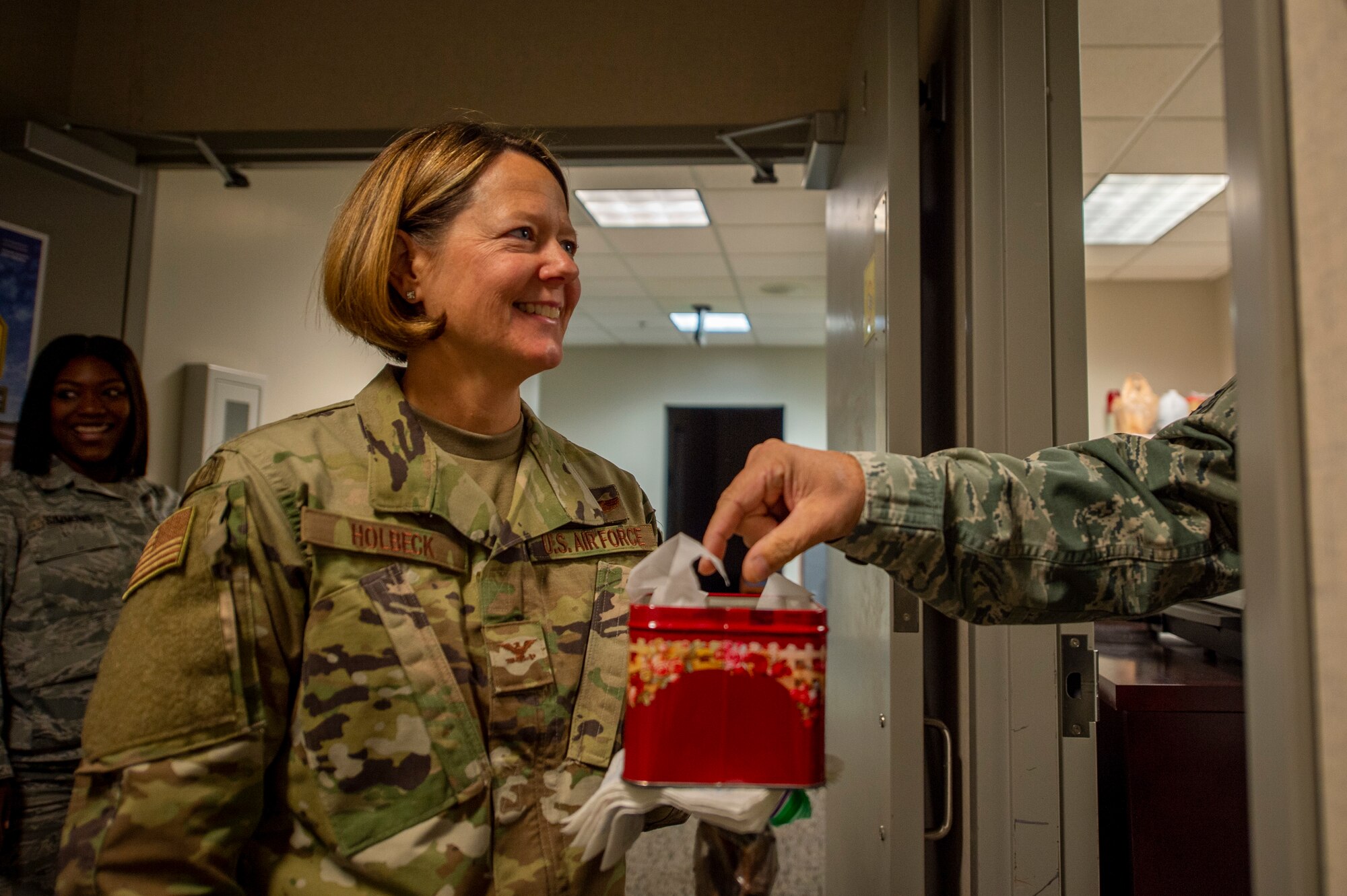 U.S. Air Force Col. Amy Holbeck, vice commander of the 116th Air Control Wing, Georgia Air National Guard, spreads holiday cheer and treats to wing personnel at Robins Air Force Base, Ga., Nov. 25, 2019.