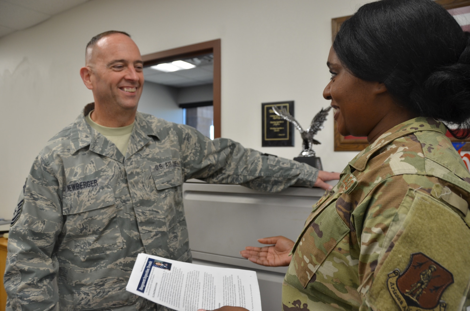 Senior Master Sgt. Scott Newberger, left, and Staff Sgt. Victoria Linder, right, members of the Wing's Diversity and Inclusion Council, discuss strategy on upcoming meetings over Unit Training Assembly, Phoenix, Ariz., November 2, 2019. (U.S. Air National Guard photo by Capt. Tinashe Machona)