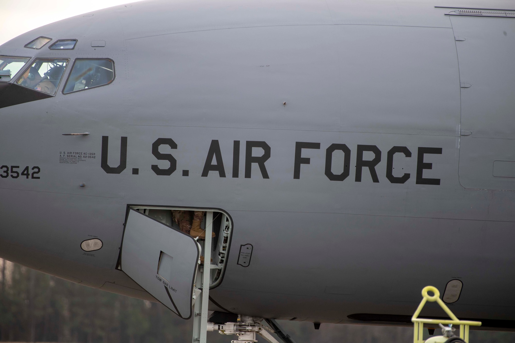 U.S. Air Force Staff Sgt. Jose A. Reyes, a 911th Air Refueling Squadron (ARS) dedicated crew chief, boards the aircraft upon completion of pre-flight checks before takeoff from Seymour Johnson Air Force Base, North Carolina, Dec. 12, 2019. This marks the last boots off the ground before the 911 ARS depart for their final mission on a KC-135 Stratotanker. (U.S. Air Force photo by Staff Sgt. Mary McKnight)