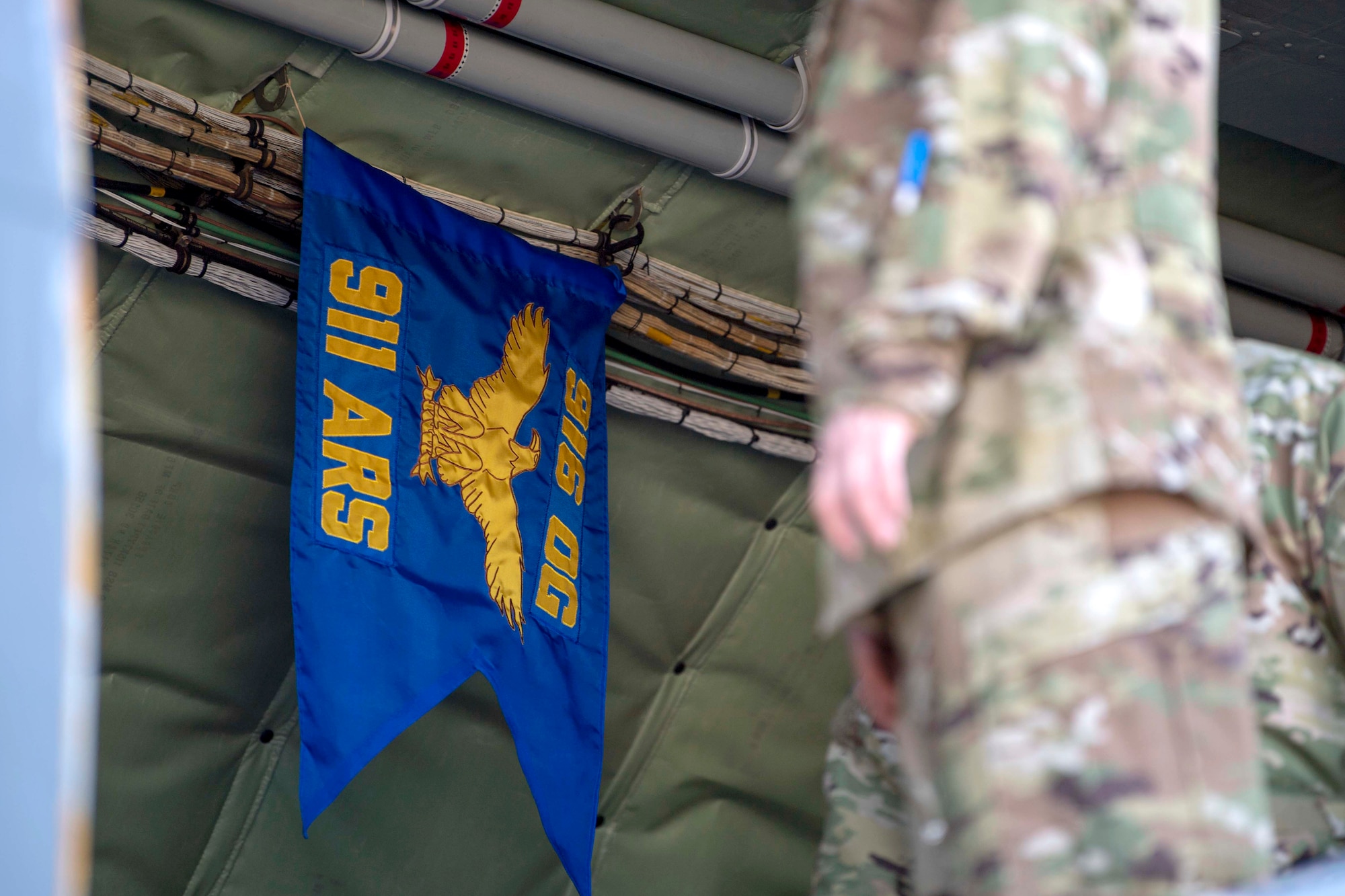 The 911th Air Refueling Squadron’s pennant hangs from the inside the aircraft as the cargo hatch is opened upon the aircraft being parked on the flightline Stratotanker on the flightline on Seymour Johnson Air Force Base, North Carolina, Dec. 16, 2019. The 911 ARS completed their final mission on a KC-135 Stratotanker. (U.S. Air Force photo by Staff Sgt. Mary McKnight)