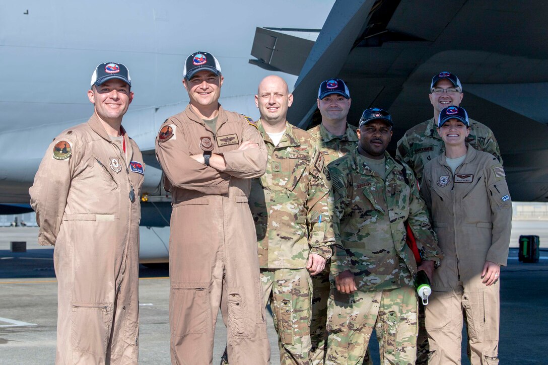 U.S. Air Force members of the 911th Air Refueling Squadron (ARS), pose for a photo on the flightline on Seymour Johnson Air Force Base, North Carolina, Dec. 16, 2019. This marks the last 911 ARS aircrew to complete a mission on a KC-135 Stratotanker. (U.S. Air Force photo by Staff Sgt. Mary McKnight)
