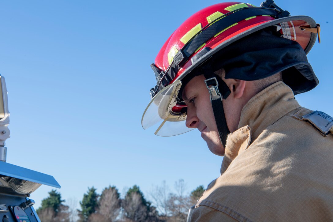 U.S. Air Force Tech. Sgt. Timothy Jordan, the 916th Civil Engineer Flight assistant chief of logistics, releases water from the truck tank to the hose line on Seymour Johnson Air Force Base, North Carolina, Jan. 9, 2020. Hose lines are used to attack internal and external fires. (U.S. Air Force photo by Staff Sgt. Mary McKnight)