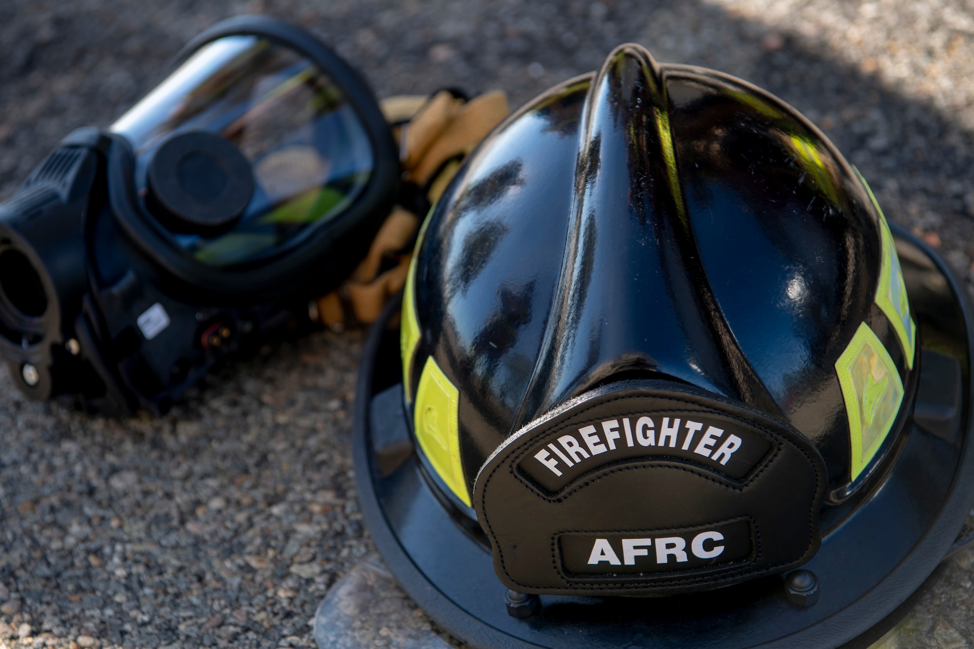 M7 FireHawk masks and fire helmets are part of the personal protective equipment firefighters must wear to reduce their chances for injury or death. (U.S. Air Force photo by Staff Sgt. Mary McKnight)