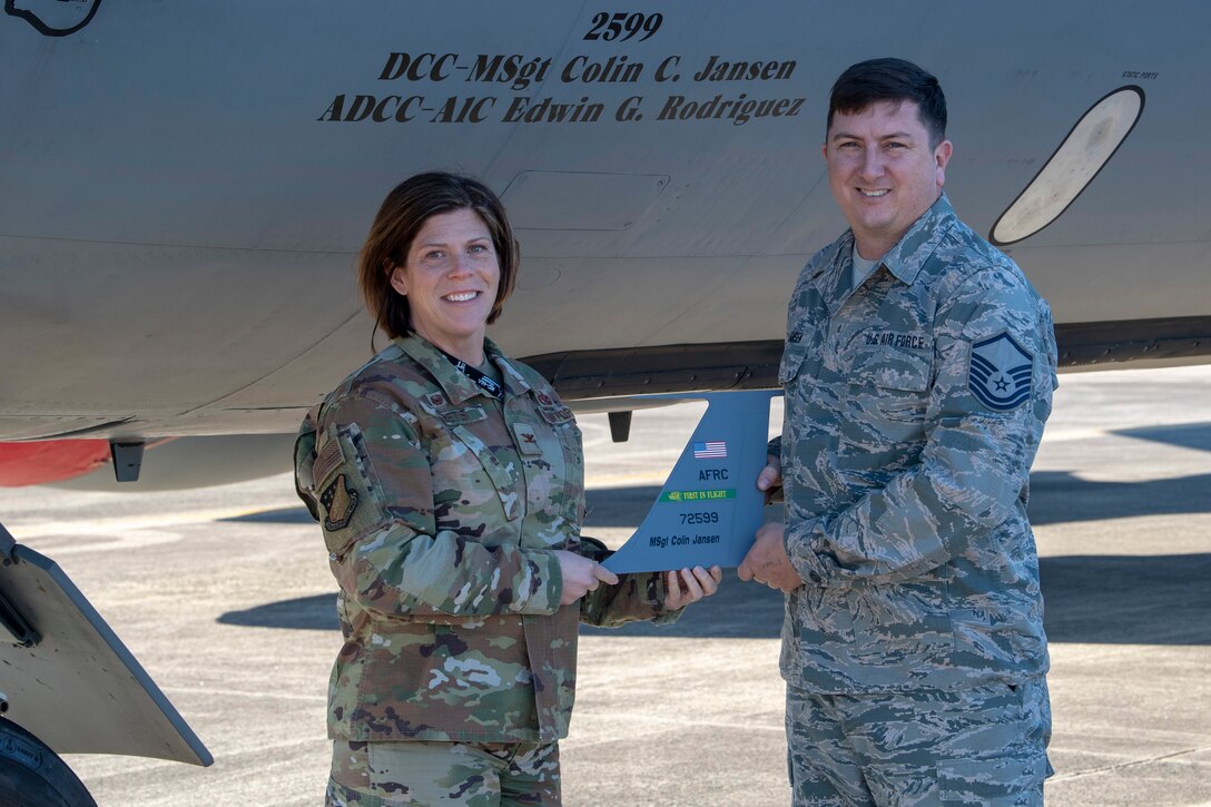 U.S. Air Force Col. Amanda M. Sheets, 916th Maintenance Group commander, presents Master Sgt. Colin C. Jansen, 916th Aircraft Maintenance Squadron dedicated crew chief, with a model vertical stabilizer of aircraft 2599 on Seymour Johnson Air Force Base, North Carolina, Jan. 8, 2020. This aircraft is the eighth KC-135 Stratotanker to be divested by the 916th Air Refueling Wing in preparation for the KC-46 Pegasus. (U.S. Air Force photo by Staff Sgt. Mary McKnight)