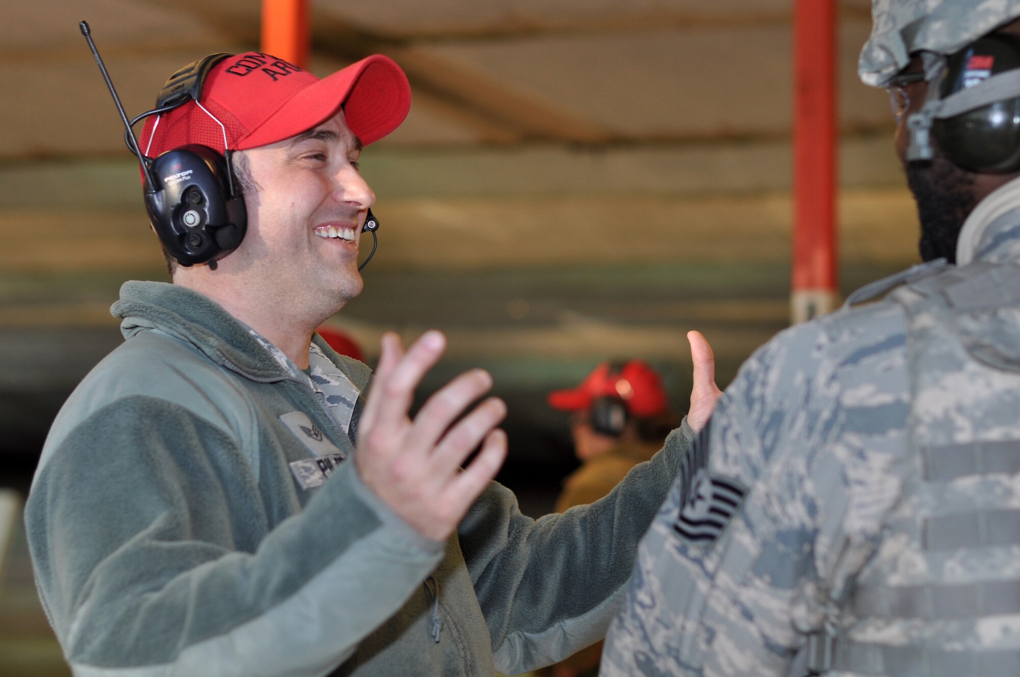 Staff Sgt. Jonathan Pilgrim, 908th Security Forces Squadron Combat Arms instructor, laughs inside the firing bay at Maxwell AFB, Alabama. Pilgrim has been a CA instructor since first joining the U.S. Air Force in 2011. (U.S. Air Force photo by Airman 1st Class Shelby S. Thurman)