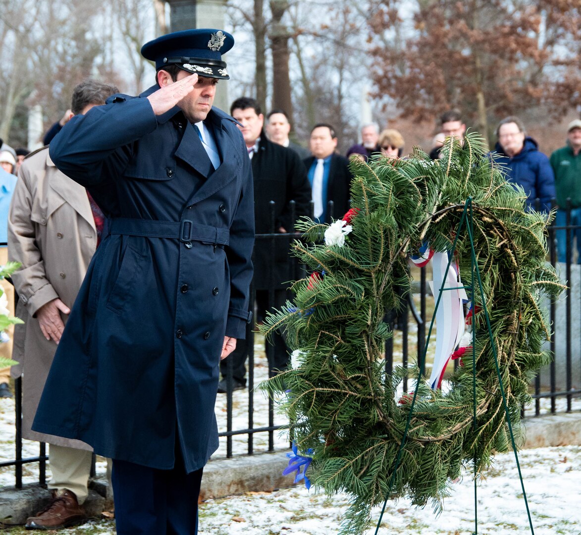 New York Air National Guard Lt. Col. Shawn Reynolds, deputy commander of the 107th Attack Wing's 107th operations group, presents a wreath from President Trump at the grave of Millard Fillmore, the 13th president of the United States, at Forest Lawn Cemetery in Buffalo, N.Y., Jan. 7, 2020, on the 220th anniversary of Fillmore's death.