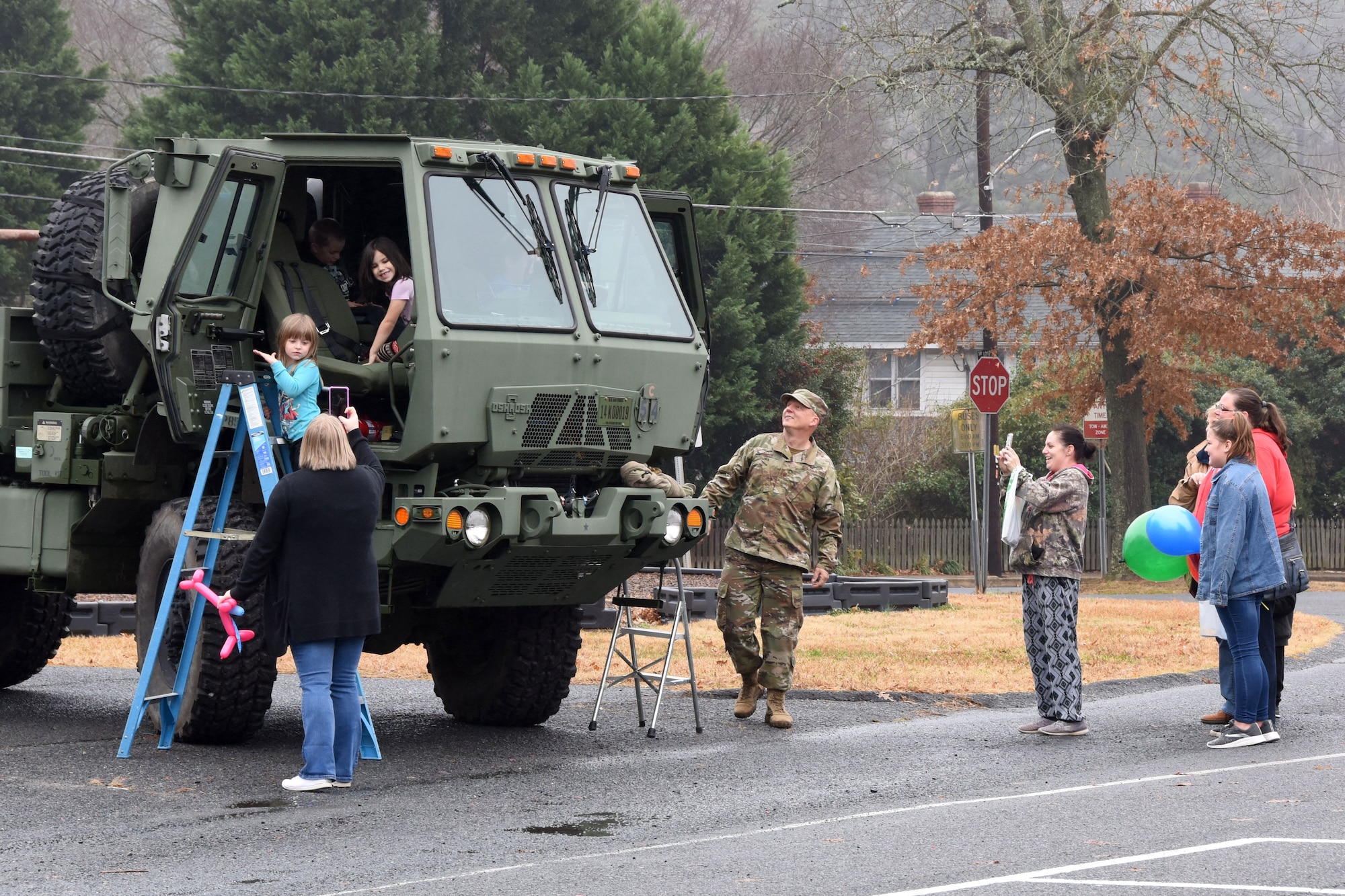 Students of Badin Elementary School (B.E.S.) enjoy climbing into a military vehicle during Operation Santa held at B.E.S., Badin, N.C., Dec. 14th, 2019.  Operation Santa is an annual event run by the Chapter 7 organization of the North Carolina Air National Guard (NCANG) which chooses select schools to provide assistance to families during the holiday season. This year, the NCANG provided presents, lunch, music, bouncy castles and a Santa. The NCANG also partnered with the local Target for food donations.