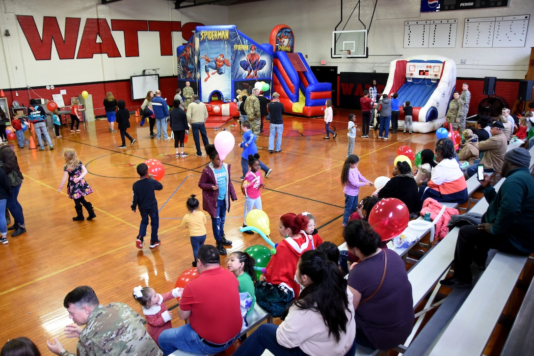 Students and families of Badin Elementary School (B.E.S.) mill around from craft tables to bouncy castles during Operation Santa held at B.E.S., Badin, N.C., Dec. 14th, 2019.  Operation Santa is an annual event run by the Chapter 7 organization of the North Carolina Air National Guard (NCANG) which chooses select schools to provide assistance to families during the holiday season. This year, the NCANG provided presents, lunch, music, bouncy castles and a Santa. The NCANG also partnered with the local Target for food donations.