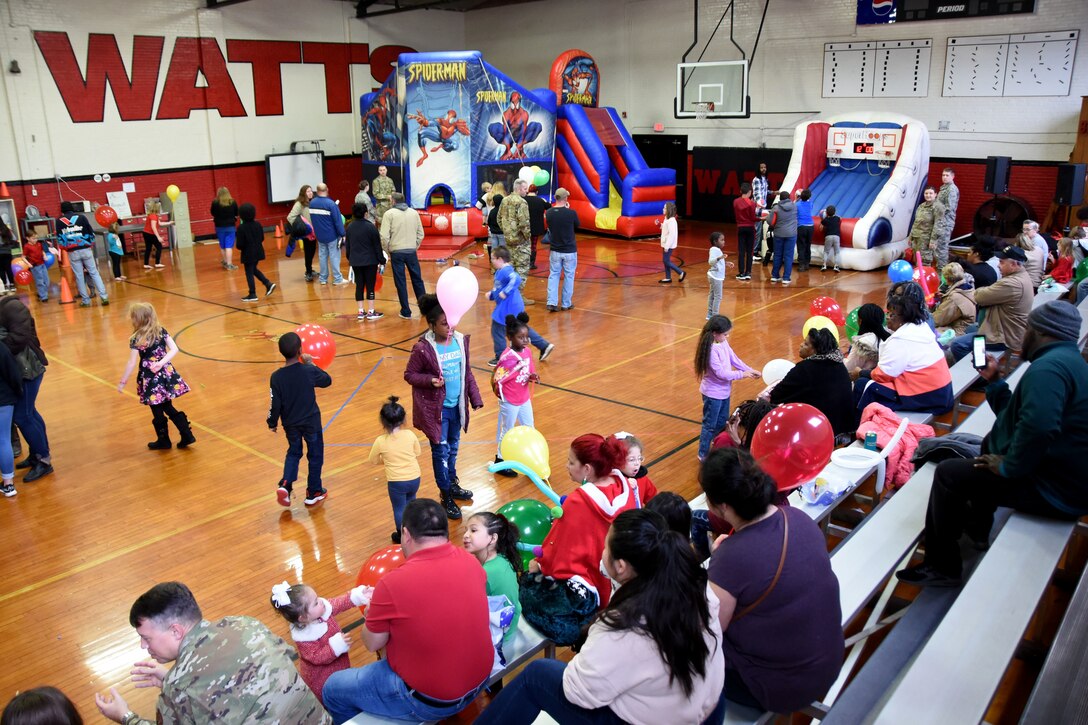 Students and families of Badin Elementary School (B.E.S.) mill around from craft tables to bouncy castles during Operation Santa held at B.E.S., Badin, N.C., Dec. 14th, 2019.  Operation Santa is an annual event run by the Chapter 7 organization of the North Carolina Air National Guard (NCANG) which chooses select schools to provide assistance to families during the holiday season. This year, the NCANG provided presents, lunch, music, bouncy castles and a Santa. The NCANG also partnered with the local Target for food donations.