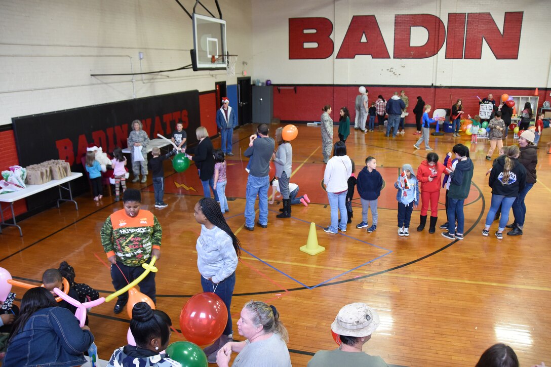 Students and families of Badin Elementary School (B.E.S.) wait in line to meet with a volunteer Santa during Operation Santa held at B.E.S., Badin, N.C., Dec. 14th, 2019.  Operation Santa is an annual event run by the Chapter 7 organization of the North Carolina Air National Guard (NCANG) which chooses select schools to provide assistance to families during the holiday season. This year, the NCANG provided presents, lunch, music, bouncy castles and a Santa. The NCANG also partnered with the local Target for food donations.