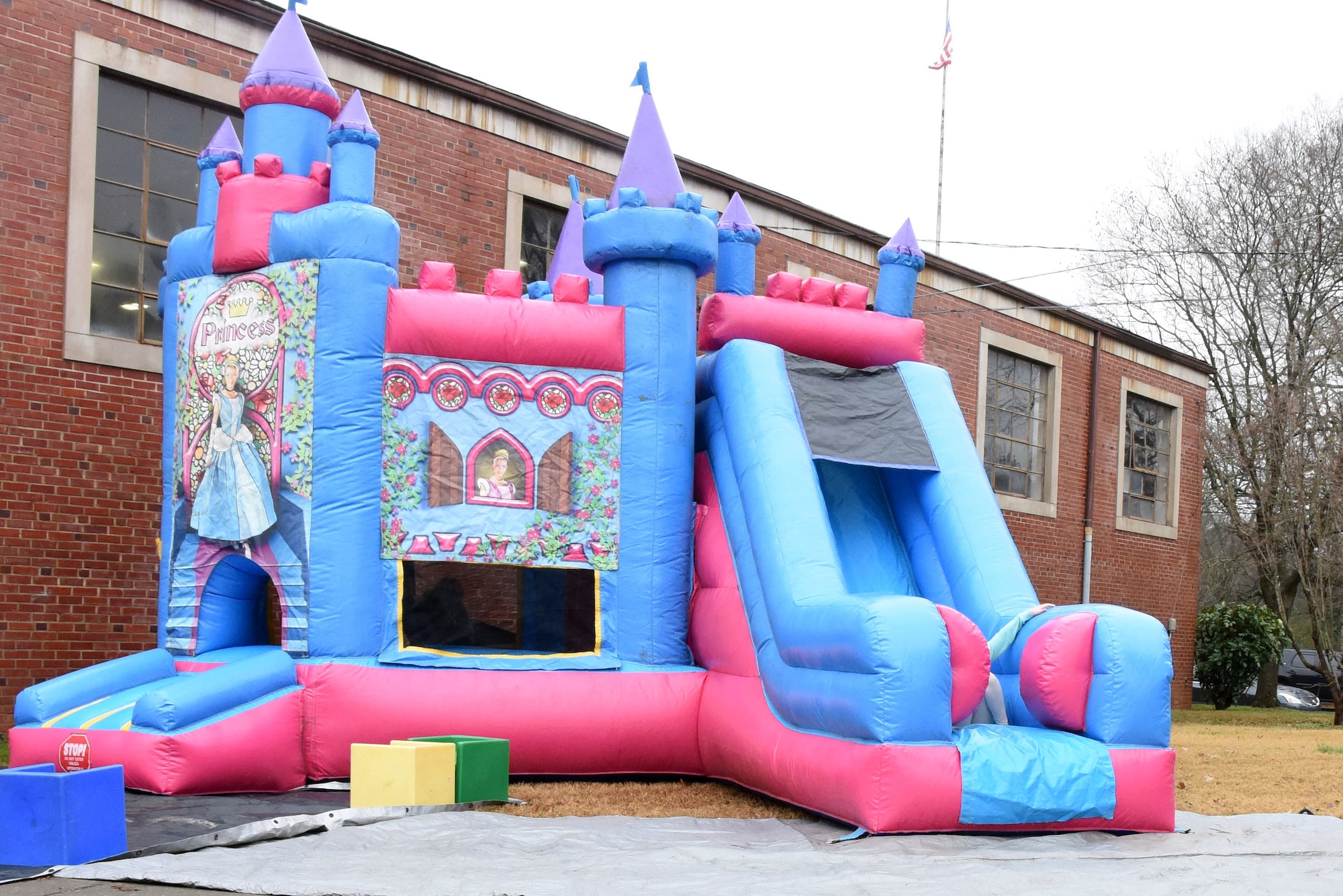 A princess bouncy castle is put to use at Badin Elementary School (B.E.S.) during Operation Santa held at B.E.S., Badin, N.C., Dec. 14th, 2019.  Operation Santa is an annual event run by the Chapter 7 organization of the North Carolina Air National Guard (NCANG) which chooses select schools to provide assistance to families during the holiday season. This year, the NCANG provided presents, lunch, music, bouncy castles and a Santa. The NCANG also partnered with the local Target for food donations.